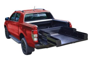 Slide-out cargo tray in a nissan navara slide out cargo tray for nissan navara